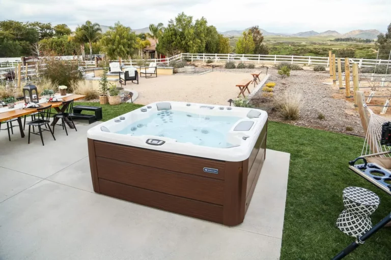 hot tub in backyard near vinyard