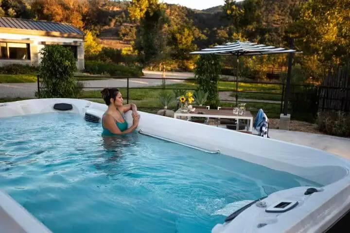 Woman Enjoying Her Backyard Swim Spa