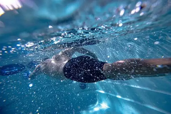 jacuzzi swim spa exercise - man swimming