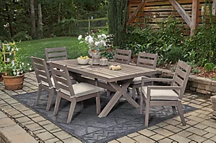 Outdoor Furniture - Take A Break Spas And Billiards Gray Outdoor Dining Table With Six Cushioned Chairs And White Flowers, Set On A Summer Patio In Soft Late-Day Lighting