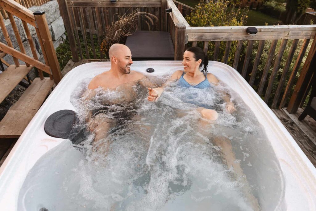 Couple Relaxing In Dreammaker Hot Tub - Take A Break Spas And Billiards