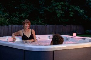 Hot Tub Vs. Swim Spa: Which One Is Right For Your Utah Backyard? - Take A Break Spas And Billiards Uncategorized Jht J508L Platinum Flax Seattle Dusk Hand Couple - Take A Break Spas And Billiards