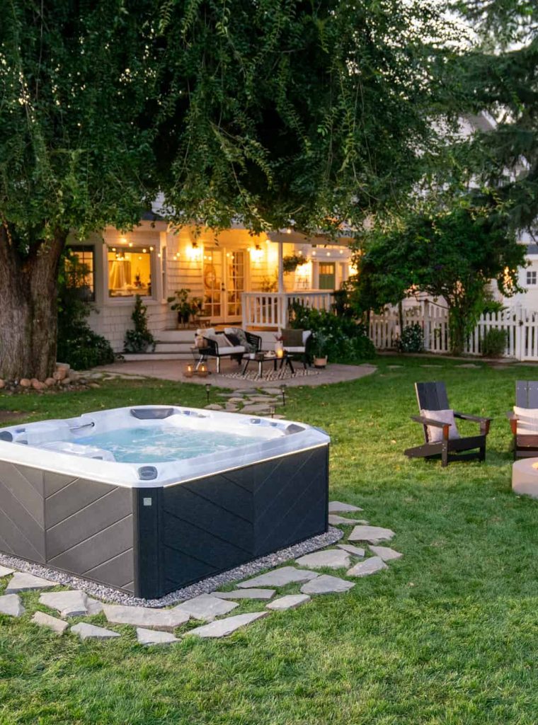 Sundance Spa Installed In Backyard Of Home In Cottonwood Heights Utah With Fire Pit And Seating Area
