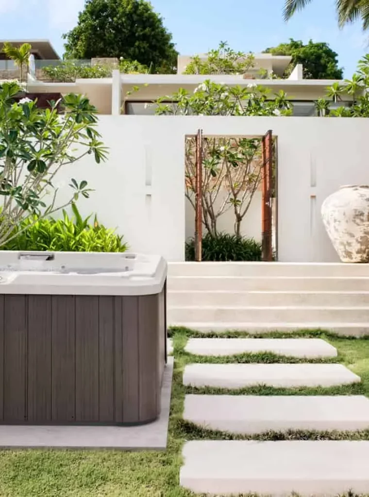 j-215-install-01 jacuzzi j-215 hot tub in backyard with lounge seat