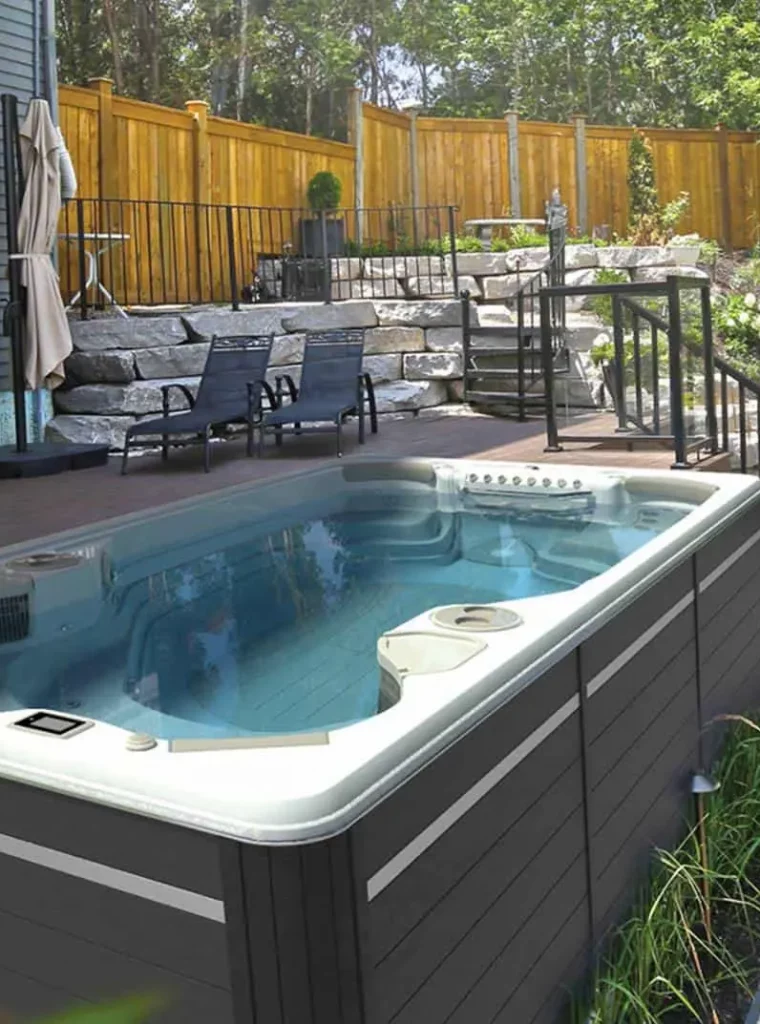 14ft swim spa by hudropool on patio in backyard